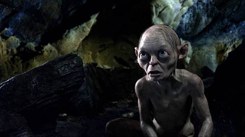 Gollum steht in einer Höhle. - Foto:  IMAGO / Cinema Publishers Collection